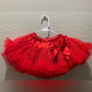Girls, red, fluffy tutu will fit a 2 to 4-year-old perfect for holiday pictures